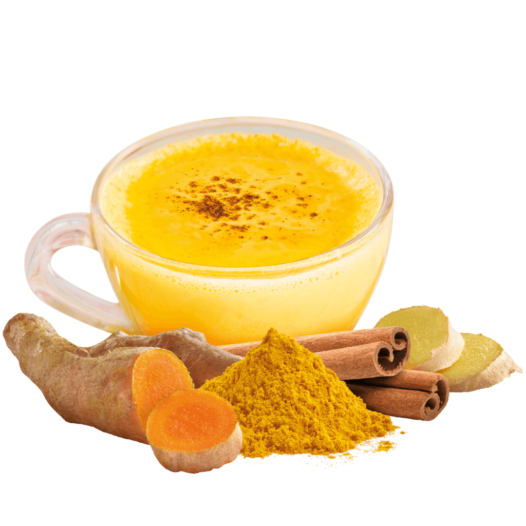 Curcuma mit Zimtstanden, Ingwer und einer Tasse Golden Milk